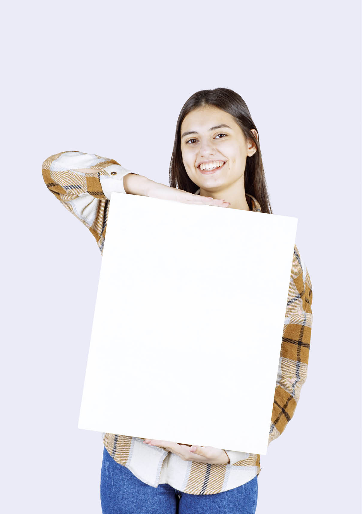 Portrait of adorable girl with white big blank posing over white wall. High quality photo
